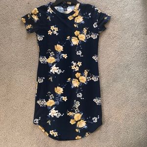 Floral dress with yellow flowers never worn.